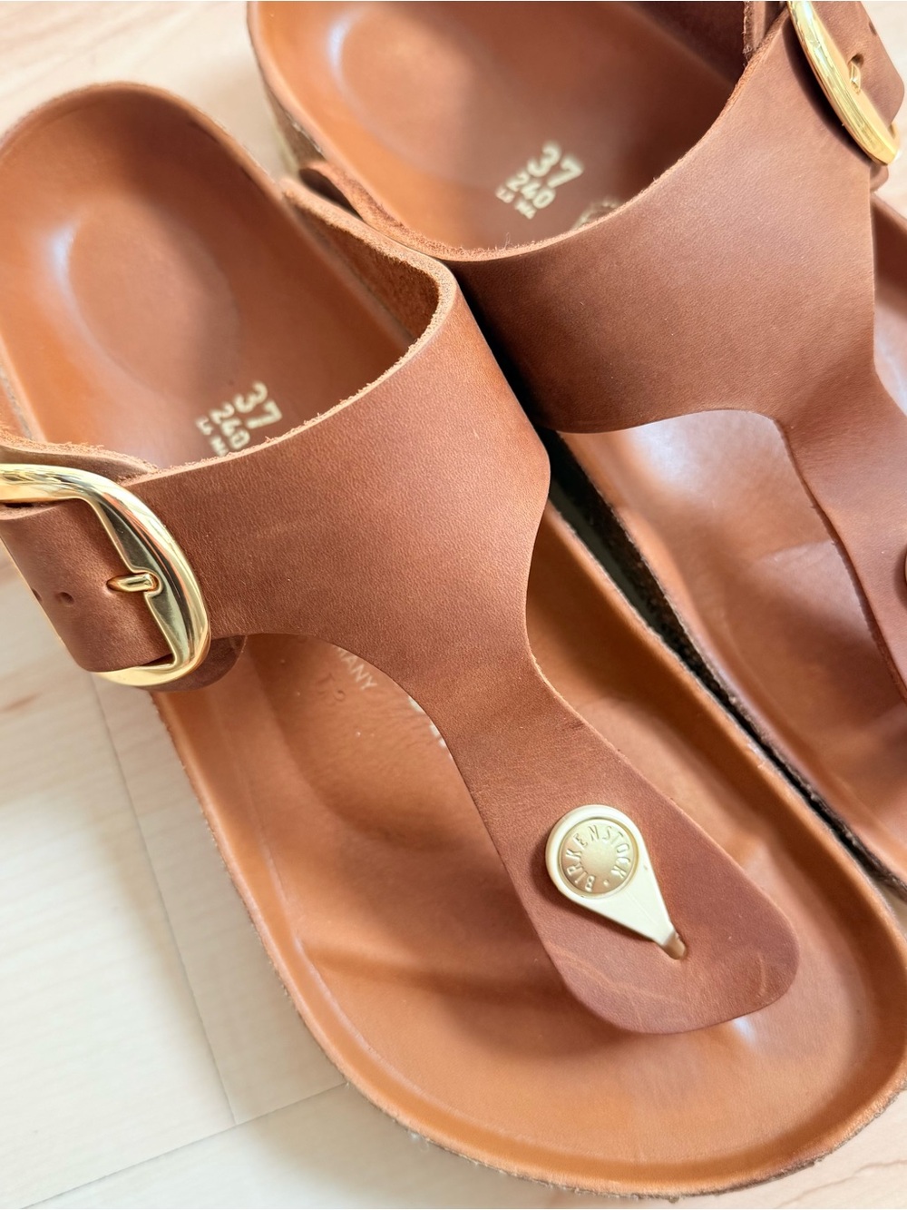 Birkenstock Leather Toe-Post Sandals in Brown with Gold Accents